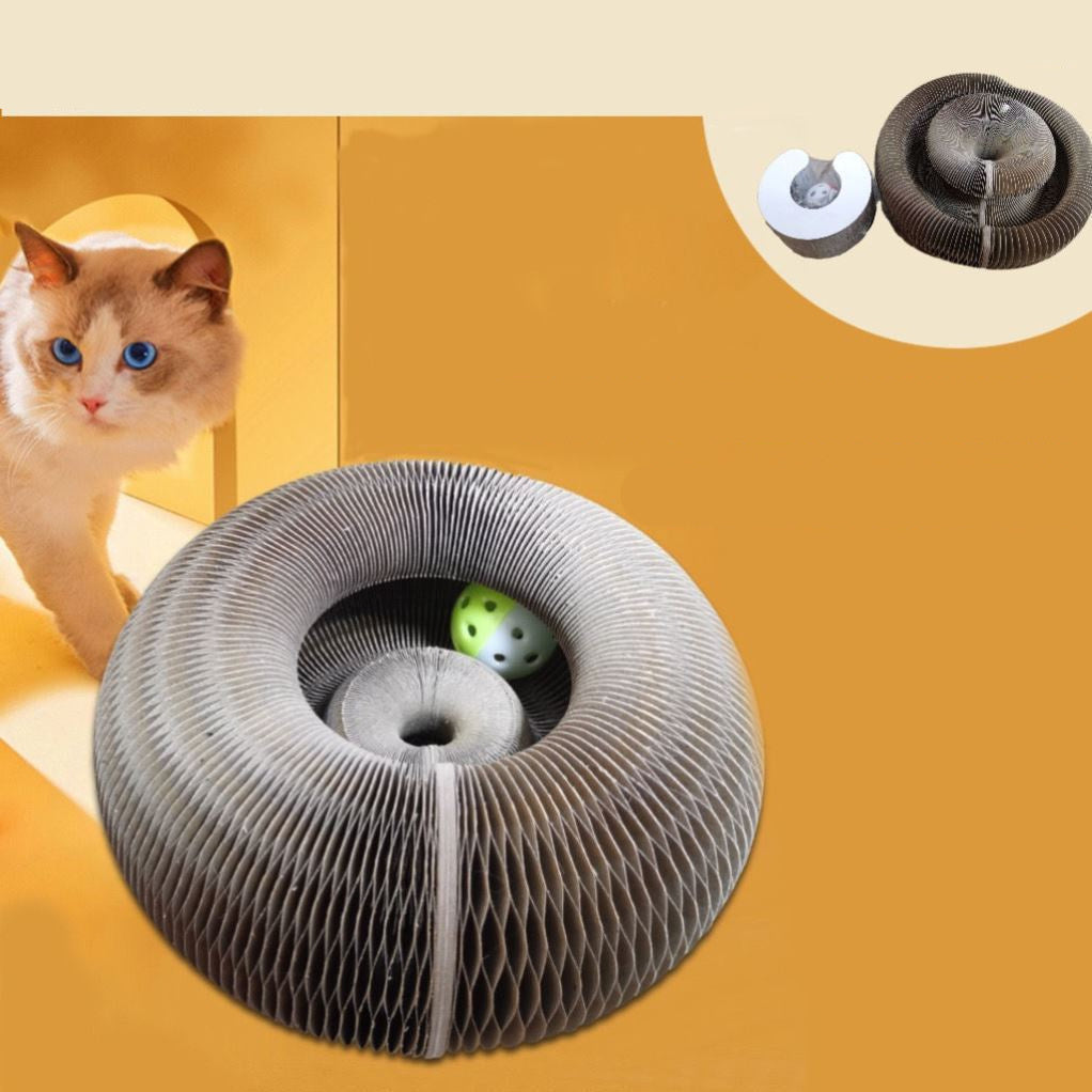 Pounce and Play Cat Scratcher toy in circular design with ball, made of corrugated paper, shown with cat on yellow background